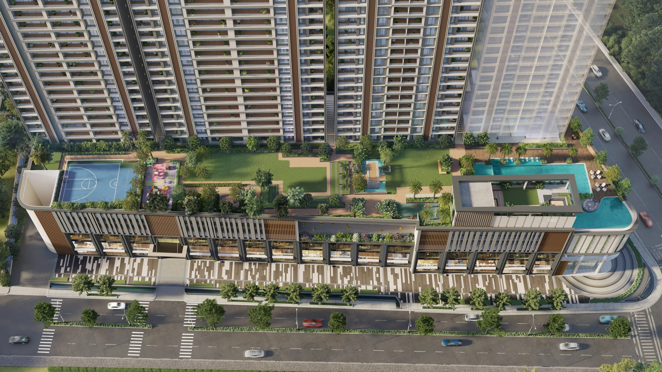 Aerial view of the E-deck pools, courts and gardens at Godrej Skyline, Mundhwa