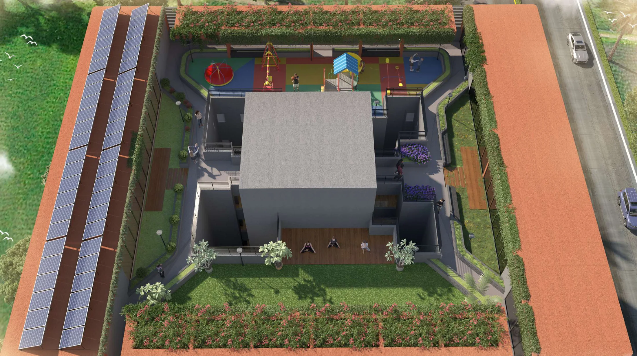 Aerial view of the rooftop lawn, jogging track and solar panels at Sai Kripa, Ravet