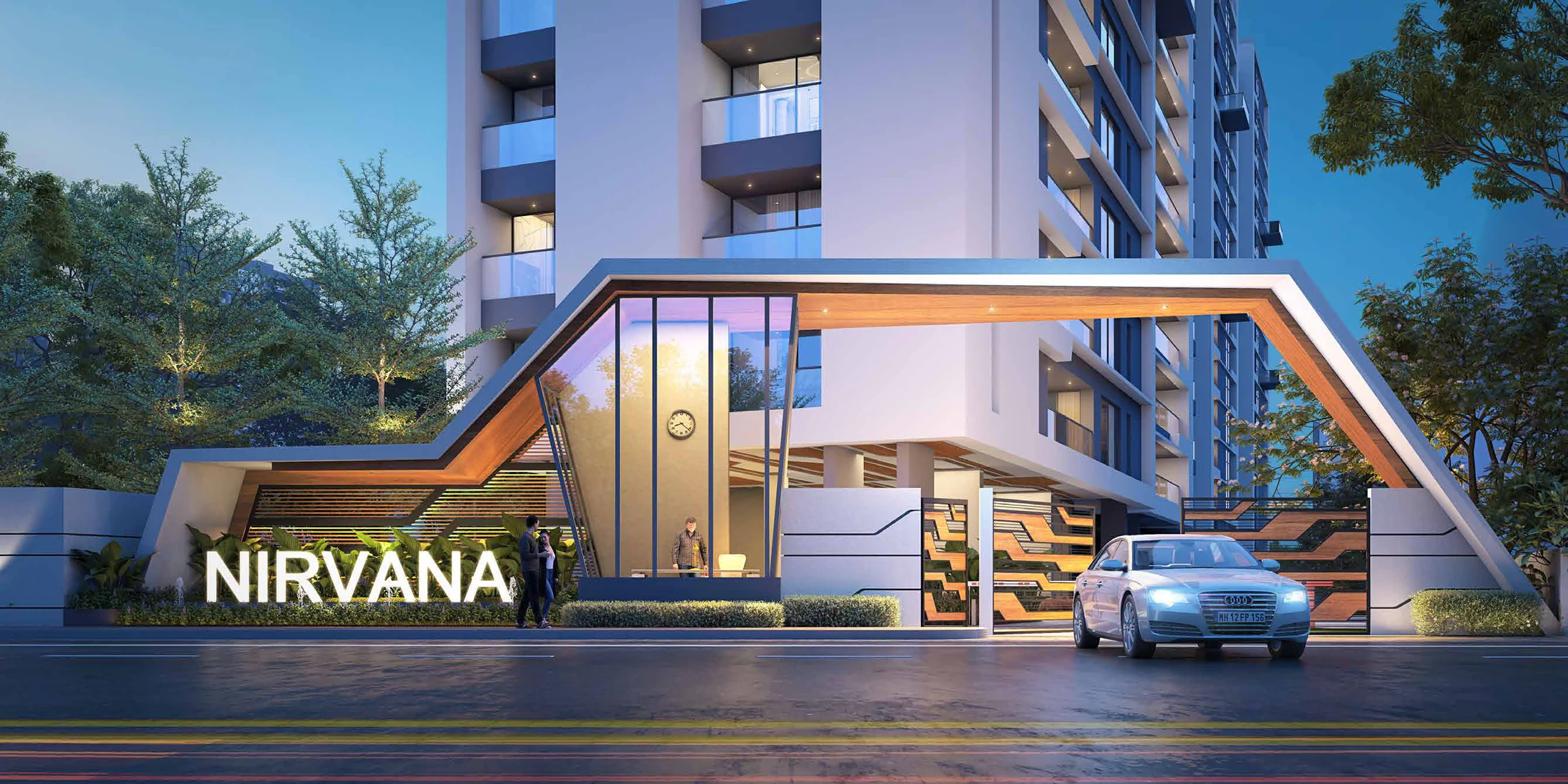 Grand entrance gate with the Nirvana name at night at Nirvana, Baner