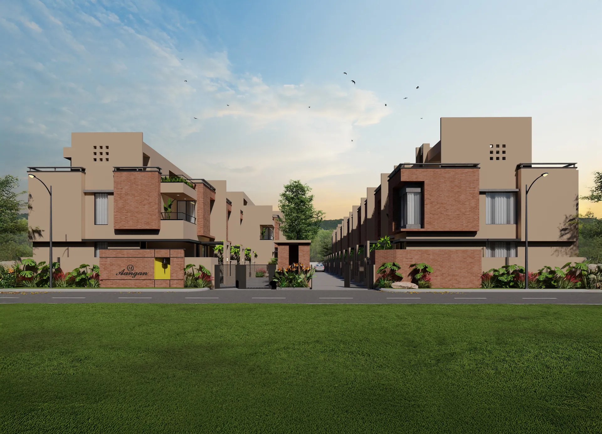 Two rows of brick-and-stone row houses behind the lawn at 18 Aangan, Maan