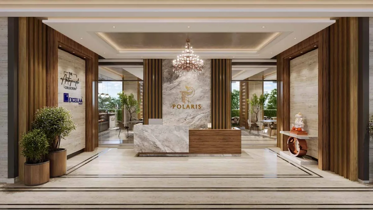 Marble entrance lobby with the Polaris reception desk at Excellaa Polaris, Bavdhan
