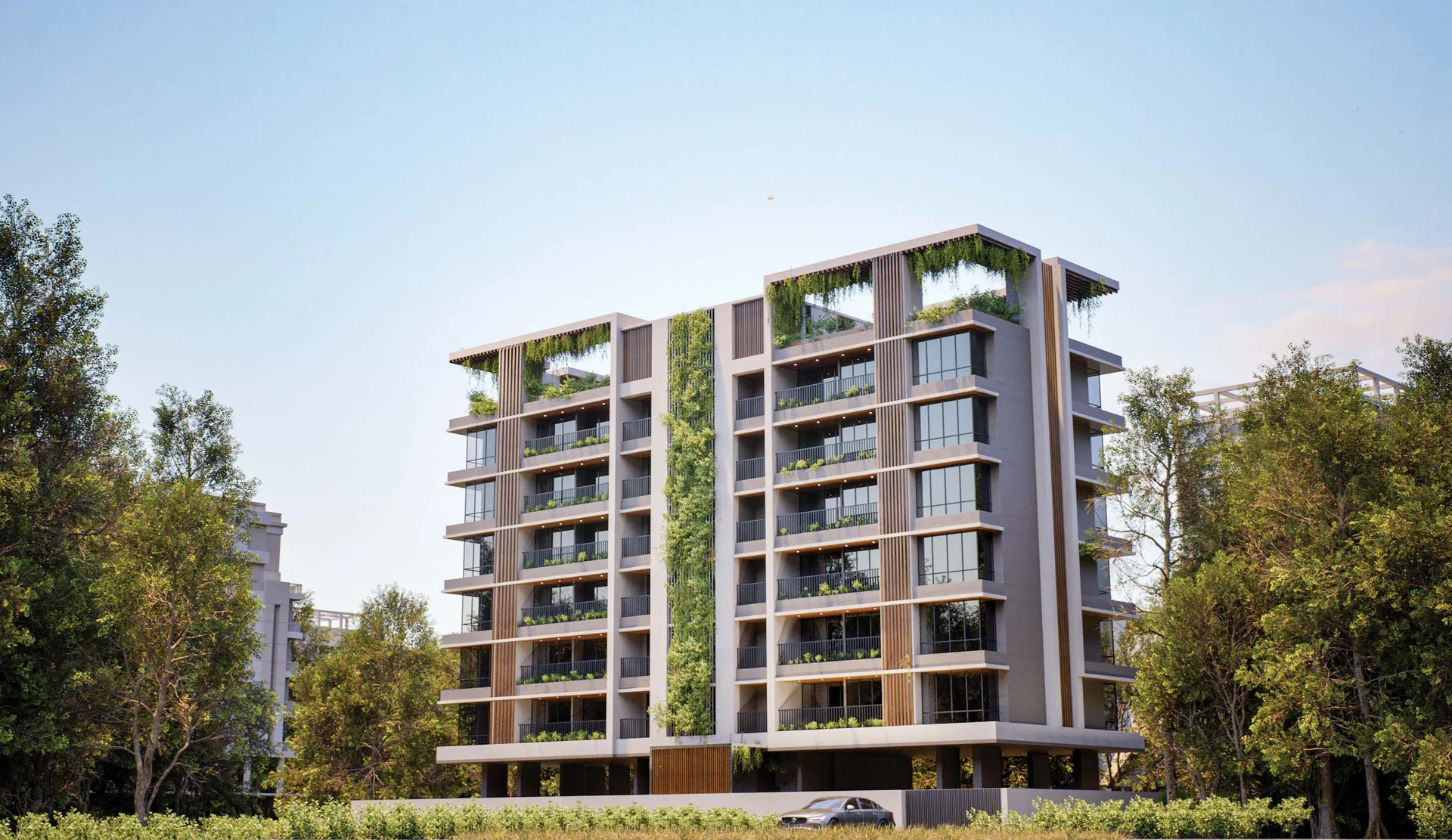 Exterior render of the tower with green façades and rooftop pergolas among trees at ASAP Tishya, Aundh