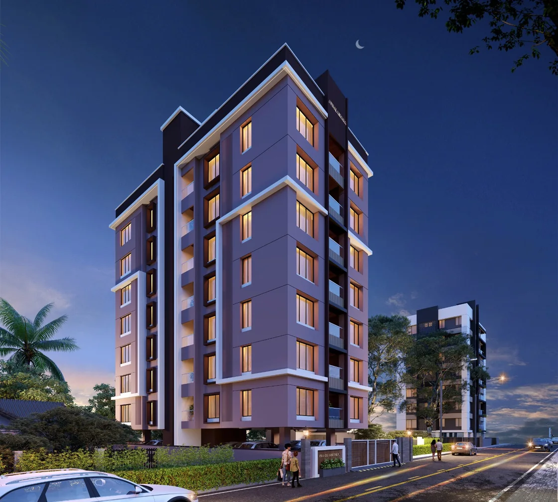 Building lit up at dusk on the main road at Vitthal Nirvana, Nigdi