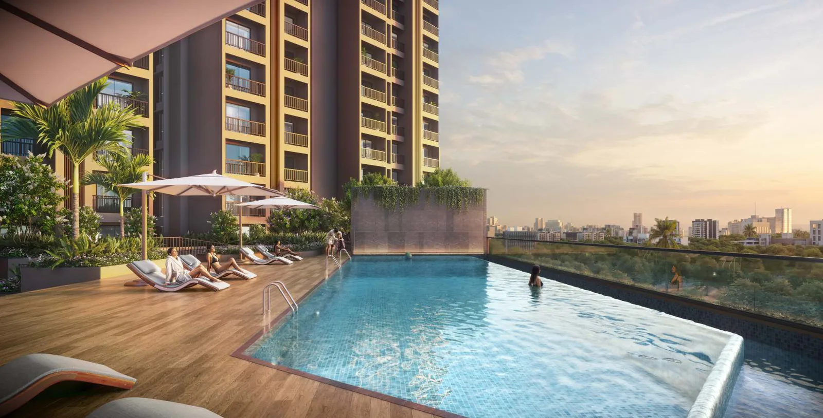 Infinity-edge swimming pool with deck loungers at Tulip Infinity Evana, Punawale