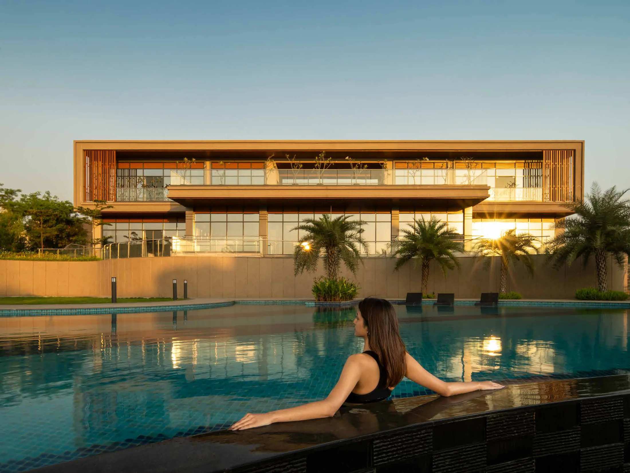 Club Villagio clubhouse beside the swimming pool at Supreme Villagio, Somatane