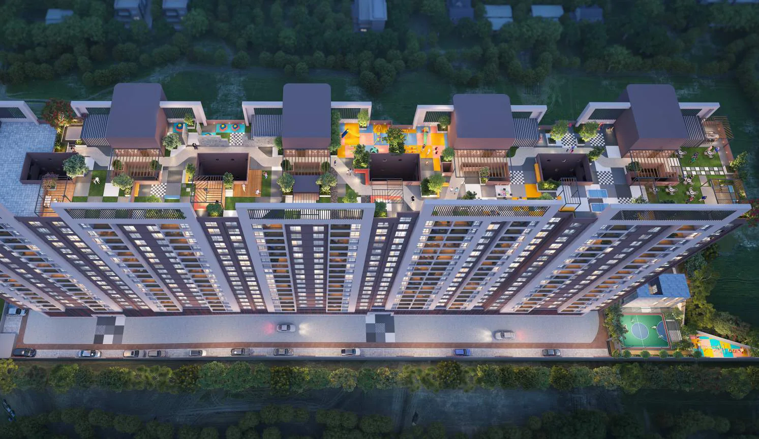 Aerial night view of the rooftop amenity terraces at Avani Amara, Mundhwa