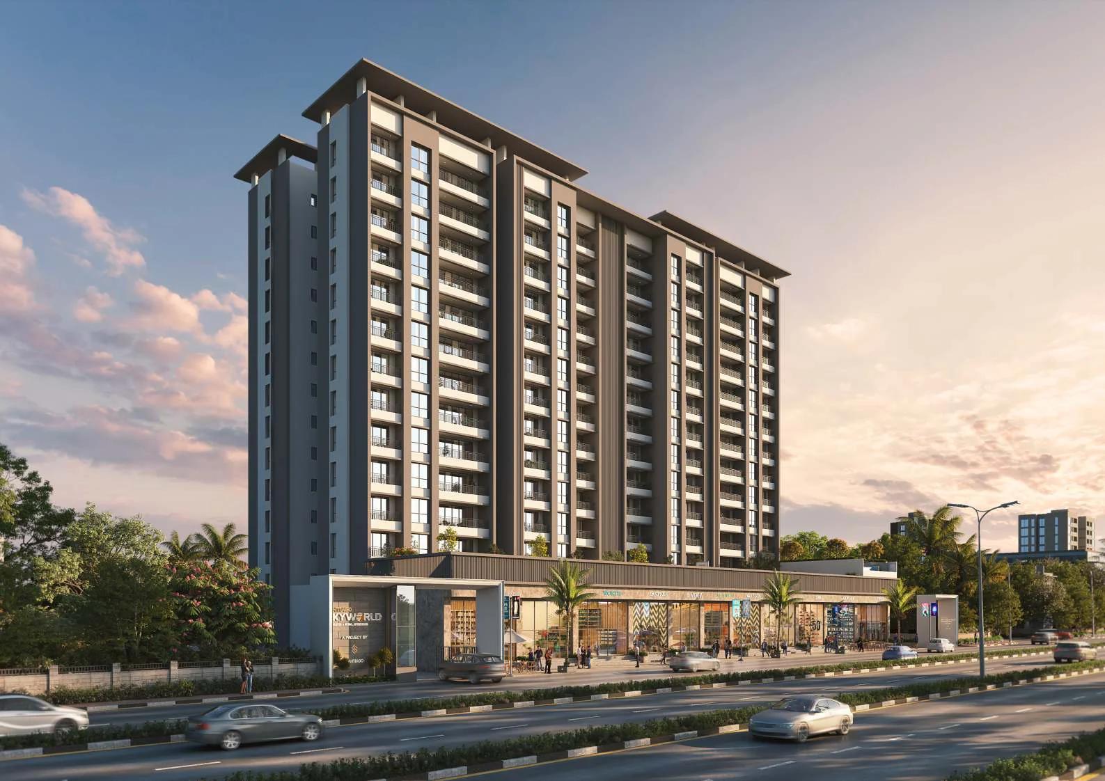 Residential tower above glass-fronted shops beside the main road at Santiago Skyworld 2.0, Bhosari