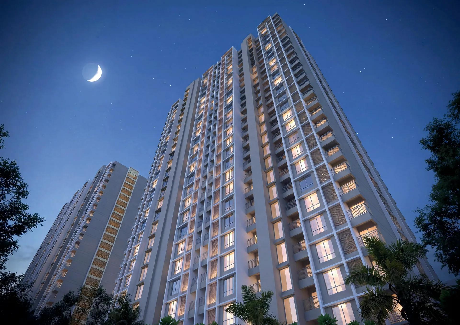 Night view of the 26-storey residential tower at Legacy Highpoint, Punawale