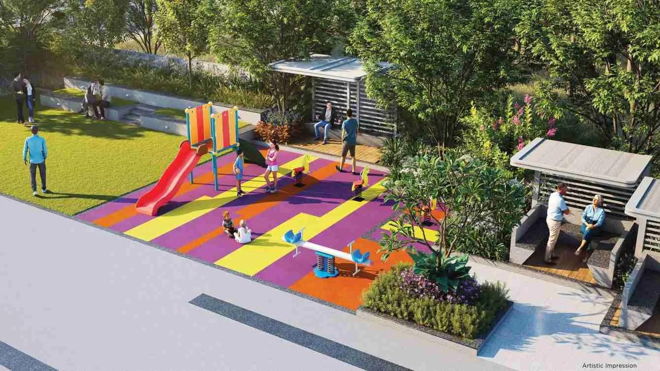 Children's play area with slide on a podium garden at Tej One, Baner