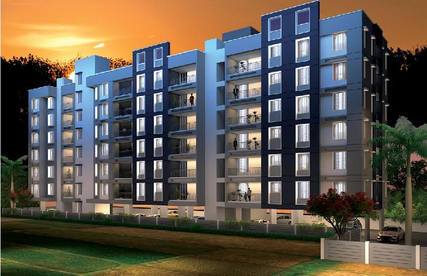 Building elevation lit up at dusk at Skyone, Walhekarwadi