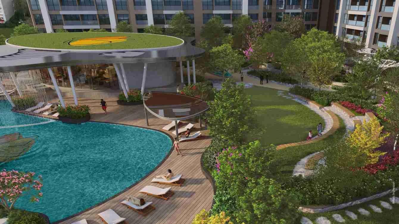 Aerial view of the podium pool, lawn and sun loungers at Yoo pristine, Akurdi