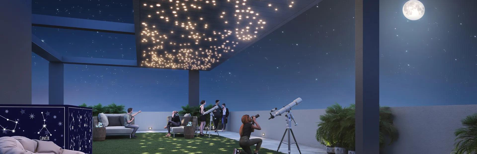 Star-gazing deck with telescopes and lounge seating under the night sky at Dream Delmont, Bavdhan