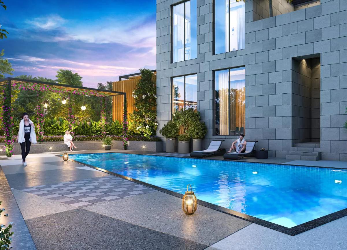 Swimming pool with deck beside the clubhouse at Avani Amara, Mundhwa