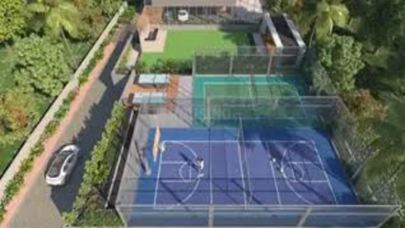 Aerial view of sports courts beside a road at Meridian Square Tathwade