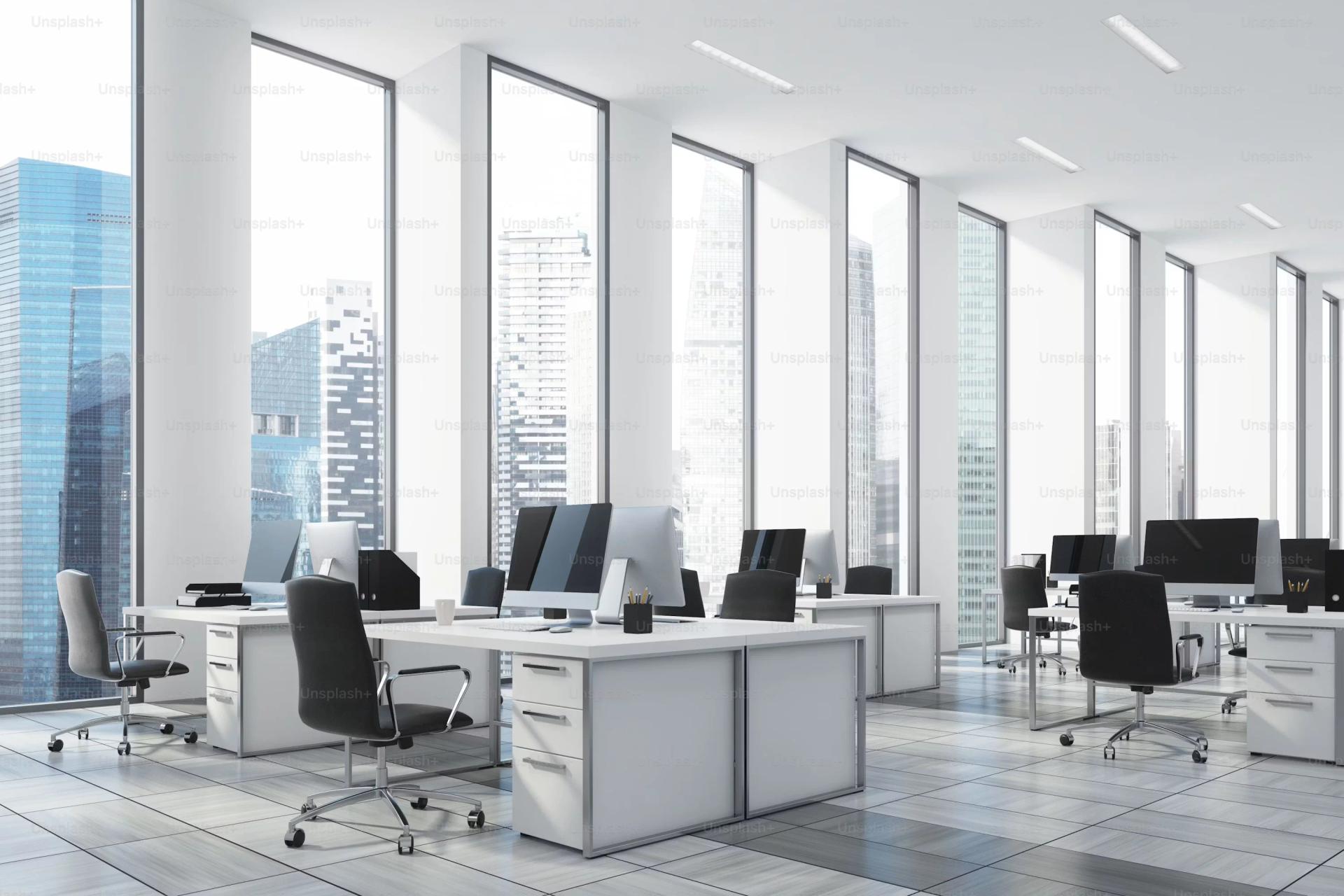 Office with white desks and tall windows at Jhamtani Bizone, Pimple Saudagar